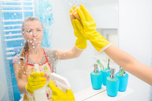 Professional domestic cleaner working in a Belsizepark kitchen